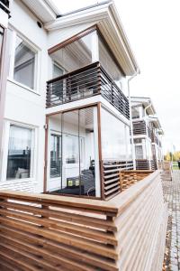 a house with large glass windows on the front of it at Apartment next to Ounasvaara and city centre in Rovaniemi
