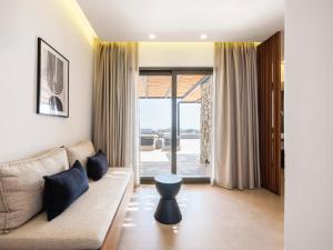 Гостиная зона в Villa Evi & Suites