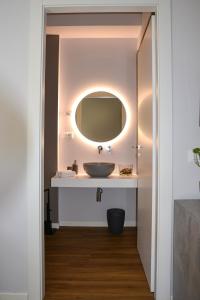 a bathroom with a sink and a mirror at Ca' dela Stazion in Verona