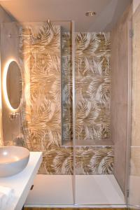 a bathroom with a shower with a wall at Ca' dela Stazion in Verona