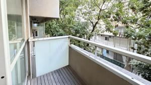 an empty balcony of a house with trees at Marais Recoleta in Buenos Aires