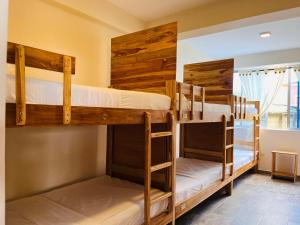 Un ou plusieurs lits dans un hébergement de l'établissement Merakai Hostel Rincon del Mar