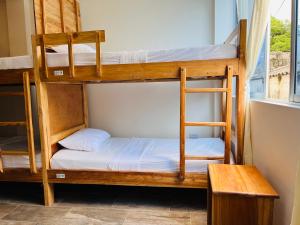 Un ou plusieurs lits dans un hébergement de l'établissement Merakai Hostel Rincon del Mar
