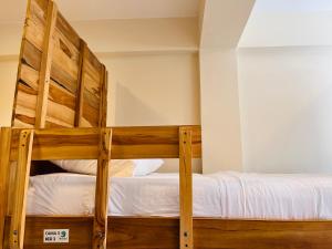 Un ou plusieurs lits dans un hébergement de l'établissement Merakai Hostel Rincon del Mar