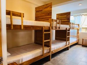 Un ou plusieurs lits dans un hébergement de l'établissement Merakai Hostel Rincon del Mar