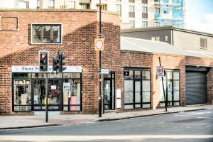 a brick building on a street with a traffic light at 2 bedroom apartment with large rooms and Wi-Fi in London