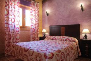 Postel nebo postele na pokoji v ubytování Mirador de Campumedra