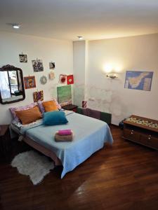 a bedroom with a bed with pillows on it at Casa Compartida Weyler in Santa Cruz de Tenerife