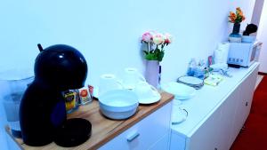 a bathroom with a counter with white dishes on it at Venice Suites in Mestre