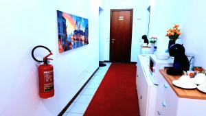 a bathroom with a red fire hydrant on the wall at Venice Suites in Mestre