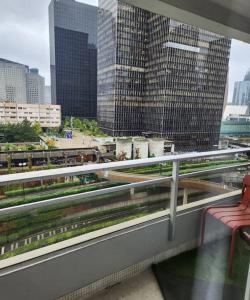 a balcony with a view of a city with buildings at Appartement La Défense in Puteaux