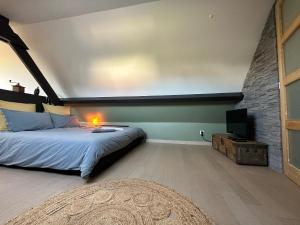Ένα ή περισσότερα κρεβάτια σε δωμάτιο στο Gîte & SPA du croquet