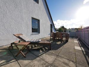 a patio with two chairs and two tables on a building at 110 m2, Dachterrasse, Küche, zentral, ruhige Lage in Paderborn