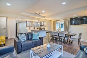 a living room with a couch and a table at Deck and Game Room Redmond Home about 17 Mi to Seattle in Redmond