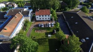 an aerial view of a white house with a yard at Virserum Hostel in Virserum