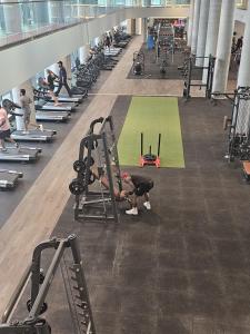 a person working out in a gym at Aethestic Apartment 2bedroom unit in Vaughan