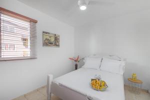 Ein Bett oder Betten in einem Zimmer der Unterkunft Acogedor Apto: Balcón, PKG, A/C, Wi-Fi & Netflix