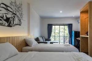 En eller flere senge i et værelse på Nine blue residence