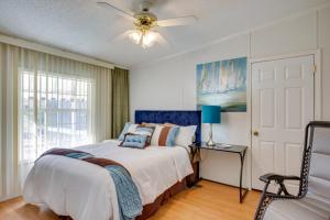 a bedroom with a bed and a ceiling fan at Spacious South Carolina Abode with Hot Tub and Grill! in Columbia