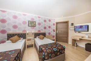 Postel nebo postele na pokoji v ubytování Asdem Park Otel