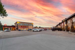 a cloudy sky above a parking lot with cars parked at Best Western PLUS City Centre Inn in Edmonton