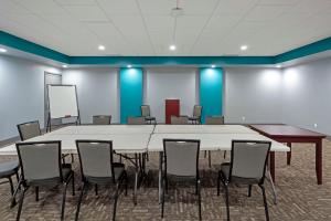 a conference room with a large white table and chairs at Best Western PLUS City Centre Inn in Edmonton +53 photos