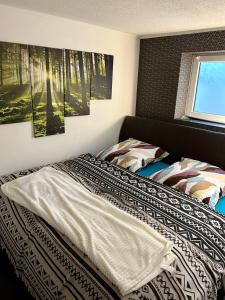 Llit o llits en una habitació de Haus mit Sauna am Waldrand - Nähe Brombachsee Altmühlsee