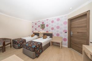 Postel nebo postele na pokoji v ubytování Asdem Park Otel