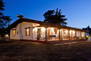 a house with lights on the side of it at Villa del Lago in Pátzcuaro