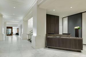 a lobby with a reception desk in a building at Hilton Boston Park Plaza in Boston