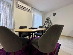 a dining room with a table and chairs at Apartment EASY HOME in Sarajevo