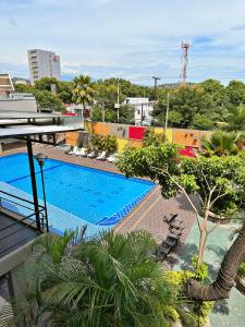 a view of a swimming pool on top of a building at Hotel Tonchalá in Cúcuta