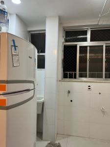 a kitchen with a refrigerator in a room at Apartamento 2 quartos Copacabana in Rio de Janeiro