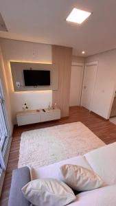 Tempat tidur dalam kamar di Elegante Apartamento, com ótima localização, na principal avenida de entrada em Bagé