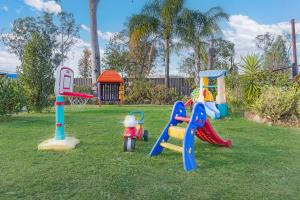 a group of playground equipment in a park at Castlereagh Motor Inn in Gilgandra