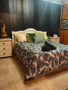 a bedroom with a bed with at Springbrook Storybook in Springbrook