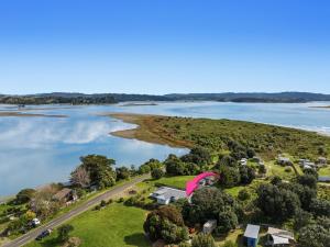 an aerial view of a house on a island in the water at Sandbach - Ohiwa Harbour in Waiotahi