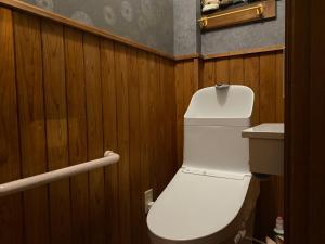 a bathroom with a white toilet and a sink at Numazu Ikyuuan 沼津一休庵 in Numazu