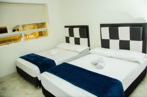 Llit o llits en una habitació de CASA HOTEL LOS ARBOLES