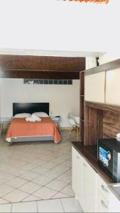 a kitchen with a bed in a room at Posada San Javier in Tequisquiapan