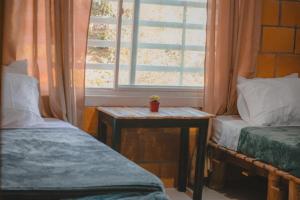 Ένα ή περισσότερα κρεβάτια σε δωμάτιο στο Hospedaje tranquilo en Armenia