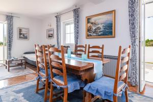 a dining room with a table and chairs at Apartments with a parking space Banjol, Rab - 5022 in Rab