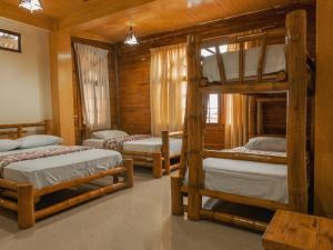 Postel nebo postele na pokoji v ubytování Hostal Poseidon