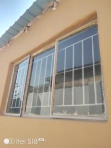 a window of a house with bars on it at AKs in Lusaka