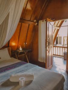 Postel nebo postele na pokoji v ubytování Leaf Coco Bungalow