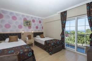 Postel nebo postele na pokoji v ubytování Asdem Park Otel