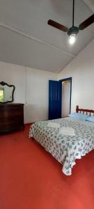 Ένα ή περισσότερα κρεβάτια σε δωμάτιο στο Pousada carrossel +20 φωτογραφίες