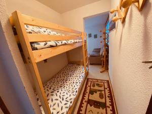 a small room with two bunk beds in it at Appartement La Clusaz, 2 pièces, 6 personnes - FR-1-459-219 in La Clusaz
