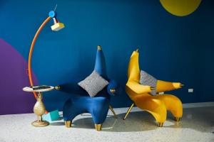 a group of toy animals sitting next to a lamp at The Fig Lobby in Bangkok
