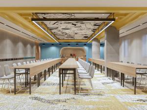a conference room with tables and white chairs at Yello Hotel Harbour Bay in Nagoya